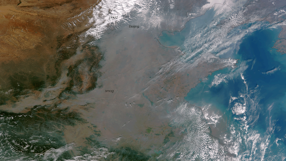 Heavy smog has shrouded much of eastern China, and air quality levels have been dropped to extremely dangerous levels. The heavy smog is caused by industrial pollution, coal and agricultural burning, and has been trapped by the mountains to the west and wind patterns. The thick haze of smog is clearly visible as the murky gray color in this true color satellite image.