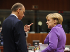 German Chancellor Angela Merkel (right) talks with Italian Prime Minister Enrico Letta on the second day of an European Council meeting in Brussels on Friday. German Chancellor Angela Merkel (right) talks with Italian Prime Minister Enrico Letta on the second day of an European Council meeting in Brussels on Friday.
