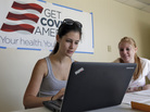Ashley Hentze (left) gets help signing up for the Affordable Care Act from a volunteer in Florida. The government says that 40 percent of the expected enrollees for 2014 must be young and healthy for health insurance premiums to remain affordable. Ashley Hentze (left) gets help signing up for the Affordable Care Act from a volunteer in Florida. The government says that 40 percent of the expected enrollees for 2014 must be young and healthy for health insurance premiums to remain affordable.