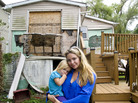 Samantha Langello and her daughter Alanna, 2, stand in front of their flood-damaged house in Fox Beach on Staten Island, N.Y. Samantha Langello and her daughter Alanna, 2, stand in front of their flood-damaged house in Fox Beach on Staten Island, N.Y.