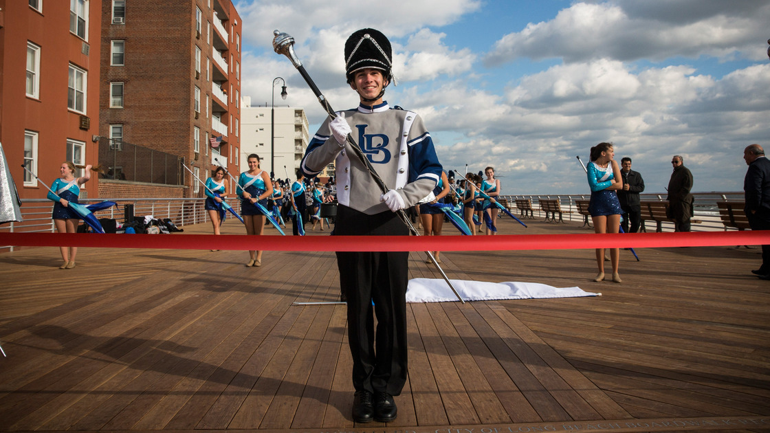 The Long Beach High School marching band prepares to march down the Long Beach boardwalk during a ribbon-cutting ceremony Friday.
