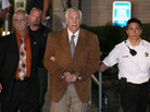 Former Penn State assistant football coach Jerry Sandusky leaves court in handcuffs after being convicted in his child sex abuse trial on June 22, 2012. Former Penn State assistant football coach Jerry Sandusky leaves court in handcuffs after being convicted in his child sex abuse trial on June 22, 2012.