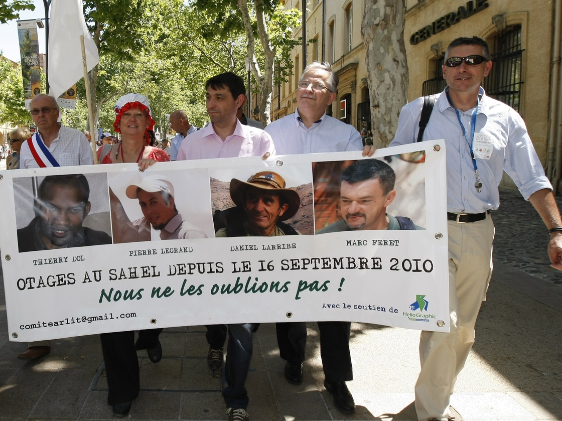The hostages' families, friends and activists demonstrate in Aix-en-Provence, France, in June.
