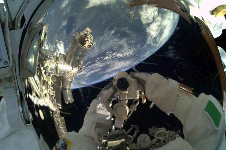 Parmitano's "selfie" in a spacesuit. Columbus, the research laboratory at the International Space Station, is visible in the reflection.