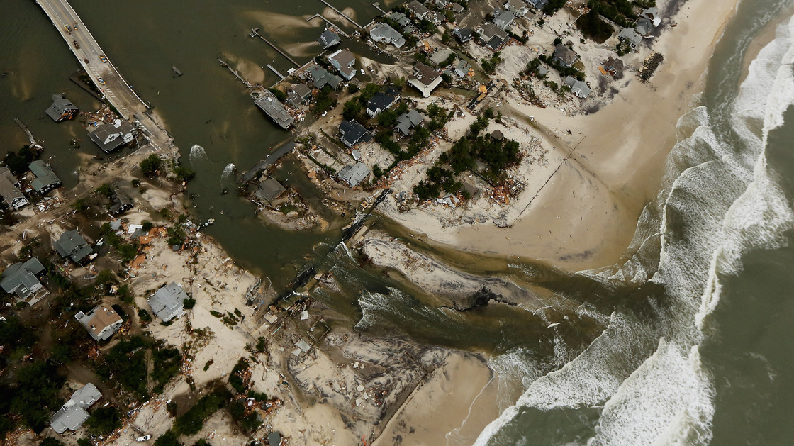 One Year Ago: Homes in Mantoloking, N.J., sit in ruin at the end of a bridge that was wrecked by flooding from Superstorm Sandy.