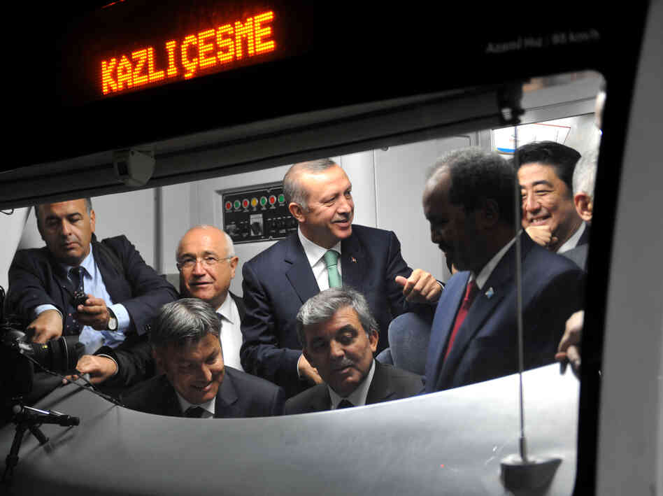 Japanese Prime Minster Shinzo Abe (right), Somalian President Hasan Sheikh Mahmud, Turkish President Abdullah Gul and Turkish Prime Minister Recep Tayyip Erdogan listen to an announcement in a train car at the Uskudar Marmaray station ahead of its inauguration ceremony in Istanbul, on Tuesday. Japanese Prime Minster Shinzo Abe (right), Somalian President Hasan Sheikh Mahmud, Turkish President Abdullah Gul and Turkish Prime Minister Recep Tayyip Erdogan listen to an announcement in a train car at the Uskudar Marmaray station ahead of its inauguration ceremony in Istanbul, on Tuesday.