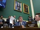 One person who got a letter canceling his health insurance was Rep. Cory Gardner, R-Colo. He holds up the letter during a congressional hearing Wednesday on insurance problems. He says his family chose to buy private insurance rather than use the congressional plan. One person who got a letter canceling his health insurance was Rep. Cory Gardner, R-Colo. He holds up the letter during a congressional hearing Wednesday on insurance problems. He says his family chose to buy private insurance rather than use the congressional plan.