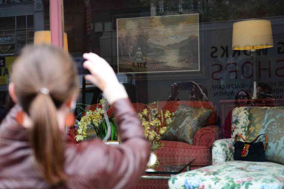 Crowds gather in front of Banksy's The Banality of the Banality of Evil, on display at the Housing Works Gramercy thrift shop in New York. Crowds gather in front of Banksy's The Banality of the Banality of Evil, on display at the Housing Works Gramercy thrift shop in New York.