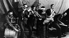 Ma Rainey Georgia Jazz Band posing for a studio group shot in the mid-1920s, with Thomas A. Dorsey at the piano. Ma Rainey Georgia Jazz Band posing for a studio group shot in the mid-1920s, with Thomas A. Dorsey at the piano.