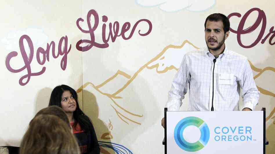 Matthew Collier, an uninsured entrepreneur, speaks at a rally sponsored by Cover Oregon in Portland, Ore., on Oct. 1. Matthew Collier, an uninsured entrepreneur, speaks at a rally sponsored by Cover Oregon in Portland, Ore., on Oct. 1.