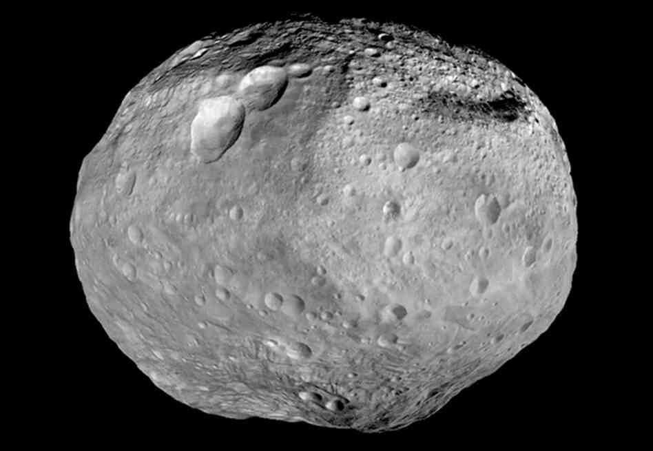 This mosaic image from NASA's Dawn spacecraft, captured between 2011 to 2012, shows the giant asteroid Vesta. The mountain at the south pole, seen at the bottom of the image, is more than twice the height of Mount Everest. This mosaic image from NASA's Dawn spacecraft, captured between 2011 to 2012, shows the giant asteroid Vesta. The mountain at the south pole, seen at the bottom of the image, is more than twice the height of Mount Everest.