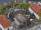 People gather in the central square of Rjukan, Norway, on Wednesday to bask in the sun reflected by mirrors on a nearby mountainside. People gather in the central square of Rjukan, Norway, on Wednesday to bask in the sun reflected by mirrors on a nearby mountainside.