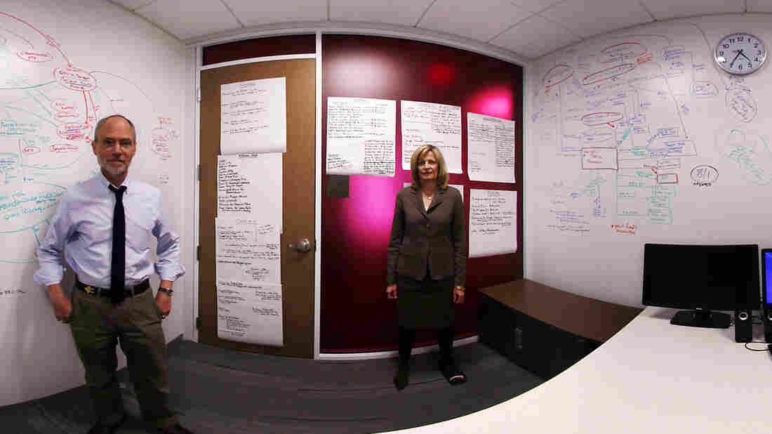In this panoramic composite image, NPR's Peter Overby and Viveca Novak of the Center for Responsive Politics stand in front of a whiteboard at NPR headquarters that they used to map out connections between social welfare groups.