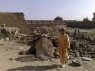 A boy stands at the site of a suspected U.S. drone attack in northwest Pakistan in 2008. Drone attacks and fighting in the region have resulted in post-traumatic stress disorder for many civilians, but few receive treatment. A boy stands at the site of a suspected U.S. drone attack in northwest Pakistan in 2008. Drone attacks and fighting in the region have resulted in post-traumatic stress disorder for many civilians, but few receive treatment.