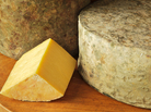 Shelburne Farms' clothbound cheddar has a bright yellow color because it's made from the milk of cows that graze on grasses high in beta-carotene. Shelburne Farms' clothbound cheddar has a bright yellow color because it's made from the milk of cows that graze on grasses high in beta-carotene.