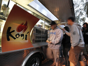 Customers line up at one of Roy Choi's Kogi BBQ food trucks near the campus of UCLA.