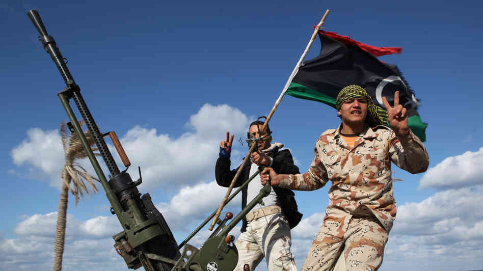 Militias from towns throughout the country's west parade through Tripoli, Libya, in 2012. Analysts say the country is awash with heavy weapons in the hands of militias divided by tribe, ideology and region. The central government has little power over the gunmen. Militias from towns throughout the country's west parade through Tripoli, Libya, in 2012. Analysts say the country is awash with heavy weapons in the hands of militias divided by tribe, ideology and region. The central government has little power over the gunmen.