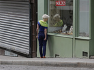 A woman walks amid both open and closed shops during a Sunday morning stroll at the Butte Montmartre in Paris, in July. Under France's Byzantine rules on Sunday trading, shops at the top of the hill are in a designated tourist area and so can open, but those at the bottom cannot. A woman walks amid both open and closed shops during a Sunday morning stroll at the Butte Montmartre in Paris, in July. Under France's Byzantine rules on Sunday trading, shops at the top of the hill are in a designated tourist area and so can open, but those at the bottom cannot.
