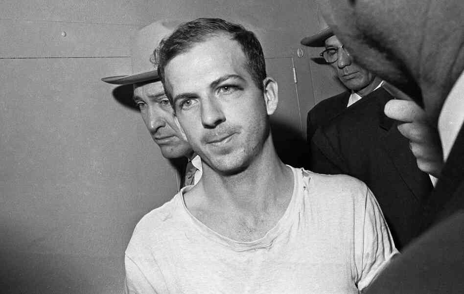 Lee Harvey Oswald is led down a corridor of the Dallas police station for questioning in connection with Kennedy's assassination on Nov. 23, 1963. Lee Harvey Oswald is led down a corridor of the Dallas police station for questioning in connection with Kennedy's assassination on Nov. 23, 1963.