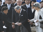 Actor turned lawmaker Taro Yamamoto (second left) hands a letter to Japan's Emperor Akihito, as Empress Michiko and chief steward Yutaka Kawashima (top center) look on during the autumn garden party at the Imperial Palace in Tokyo on Oct. 31. Actor turned lawmaker Taro Yamamoto (second left) hands a letter to Japan's Emperor Akihito, as Empress Michiko and chief steward Yutaka Kawashima (top center) look on during the autumn garden party at the Imperial Palace in Tokyo on Oct. 31.