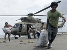 Survivors of Typhoon Haiyan in the central Philippines coastal village of Capiz got some help Monday when a Filipino military helicopter brought some much-needed food. Survivors of Typhoon Haiyan in the central Philippines coastal village of Capiz got some help Monday when a Filipino military helicopter brought some much-needed food.