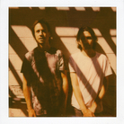 No Age poses for a Polaroid outside KEXP in Seattle. No Age poses for a Polaroid outside KEXP in Seattle.