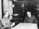 German Chancellor Adolf Hitler, talks with Spain's Generalissimo Francisco Franco, in Hendaye, France, October 23, 1940, in Hitler's railway carriage. Later, Franco moved Spain's clocks ahead an hour to be aligned with Nazi Germany. German Chancellor Adolf Hitler, talks with Spain's Generalissimo Francisco Franco, in Hendaye, France, October 23, 1940, in Hitler's railway carriage. Later, Franco moved Spain's clocks ahead an hour to be aligned with Nazi Germany.