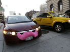 A Lyft driver in San Francisco drops off a passenger as a taxi passes by. The smartphone app lets city dwellers hitch rides from strangers. A Lyft driver in San Francisco drops off a passenger as a taxi passes by. The smartphone app lets city dwellers hitch rides from strangers.