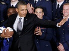 President Obama strikes the Heisman Trophy pose after he awarded the Commander-in-Chief Trophy to the Air Force Academy football team in April 2012. President Obama strikes the Heisman Trophy pose after he awarded the Commander-in-Chief Trophy to the Air Force Academy football team in April 2012.
