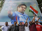 Cricket fans holding an Indian national flag cheer in front of a billboard of superstar cricketer Sachin Tendulkar outside a stadium in Mumbai on Thursday. India's favorite son dominated the sport for nearly a quarter of a century. Now, that fabled career is coming to a close. Cricket fans holding an Indian national flag cheer in front of a billboard of superstar cricketer Sachin Tendulkar outside a stadium in Mumbai on Thursday. India's favorite son dominated the sport for nearly a quarter of a century. Now, that fabled career is coming to a close.
