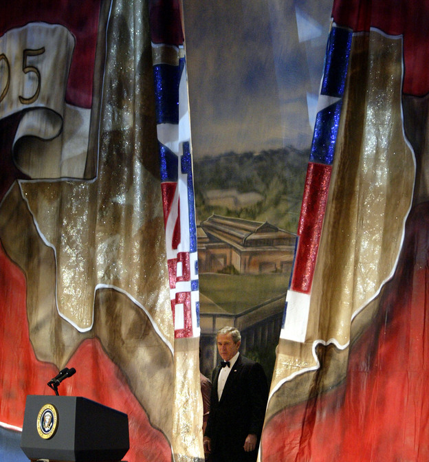 President George W. Bush appears behind a curtain painted with the outline of Texas at the Black Tie and Boots Inaugural Ball in Washington, D.C., on Jan. 19, 2005. (Image credit: Reuters /Landov)