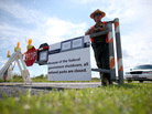 U.S. Park Ranger Mirta Maltes stands near the road-closed sign leading to the Everglades National Park on Oct. 7 in Miami. U.S. Park Ranger Mirta Maltes stands near the road-closed sign leading to the Everglades National Park on Oct. 7 in Miami.