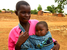 Christina Asima says she had no choice but to marry last year at age 12 to help care for younger siblings after her mother abandoned the family. But she says her husband was abusive, so she left him, and now must look after her 8-month-old son, Praise, alone. Christina Asima says she had no choice but to marry last year at age 12 to help care for younger siblings after her mother abandoned the family. But she says her husband was abusive, so she left him, and now must look after her 8-month-old son, Praise, alone.