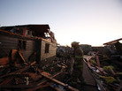 A firefighter searches through debris in Washington, Ill., on Sunday. Tornadoes and severe weather roared through the area earlier in the day. A firefighter searches through debris in Washington, Ill., on Sunday. Tornadoes and severe weather roared through the area earlier in the day.