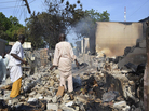 Men walk amid rubble after Boko Haram militants raided the town of Benisheik in northeast Nigeria, on Sept. 19. The Islamist group has been waging an insurgency in northern and central Nigeria for the past four years and was recently placed on the U.S. list of terrorist groups. Men walk amid rubble after Boko Haram militants raided the town of Benisheik in northeast Nigeria, on Sept. 19. The Islamist group has been waging an insurgency in northern and central Nigeria for the past four years and was recently placed on the U.S. list of terrorist groups.