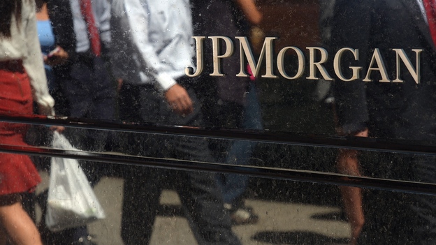JPMorgan Chase & Co. agreed to a $13 billion settlement over faulty mortgage securities with the Justice Department on Tuesday, though it did not admit any wrongdoing. (Image credit: AFP/Getty Images)