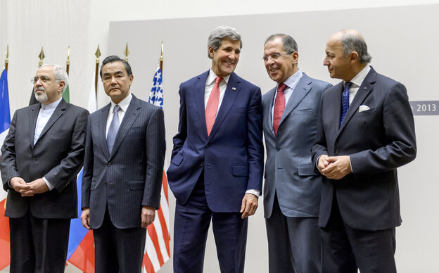 Iranian Foreign Minister Mohammad Javad Zarif, Chinese Foreign Minister Wang Yi, U.S. Secretary of State John Kerry, Russian Foreign Minister Sergei Lavrov and French Foreign Minister Laurent Fabius react during a statement early Sunday in Geneva.