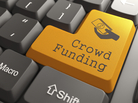 A "Crowd Funding" button on a computer keyboard A "Crowd Funding" button on a computer keyboard