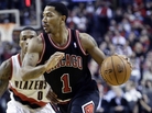 Chicago Bulls guard Derrick Rose, right, is out for the season after injuring his right knee Friday against the Portland Trail Blazers. Rose missed all of last season with an injury to his left knee. Chicago Bulls guard Derrick Rose, right, is out for the season after injuring his right knee Friday against the Portland Trail Blazers. Rose missed all of last season with an injury to his left knee.