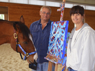 Metro Meteor, a retired racehorse, stands with owners Ron and Wendy Krajewski and one of his paintings at Motters Station Stables in Rocky Ridge, Md., earlier this year. Metro Meteor, a retired racehorse, stands with owners Ron and Wendy Krajewski and one of his paintings at Motters Station Stables in Rocky Ridge, Md., earlier this year.