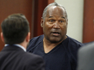 O.J. Simpson stands at the end of a May 17 hearing in Clark County District Court in Las Vegas. A judge on Tuesday said Simpson is not entitled to a new trial on his 2008 convictions for armed robbery and kidnapping. O.J. Simpson stands at the end of a May 17 hearing in Clark County District Court in Las Vegas. A judge on Tuesday said Simpson is not entitled to a new trial on his 2008 convictions for armed robbery and kidnapping.