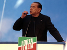 Former Italian Prime Minister Silvio Berlusconi gestures during a speech to supporters Wednesday in Rome. Former Italian Prime Minister Silvio Berlusconi gestures during a speech to supporters Wednesday in Rome.