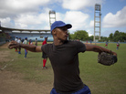 A player for Havana's Industriales baseball team winds up to throw a ball during a training session in Havana on Sept. 27. Cuba recently lifted a ban on its athletes' signing contracts to play overseas professionally. A player for Havana's Industriales baseball team winds up to throw a ball during a training session in Havana on Sept. 27. Cuba recently lifted a ban on its athletes' signing contracts to play overseas professionally.