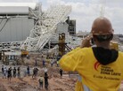 A metal structure atop the Corinthians Arena is seen after a collapse Wednesday in Sao Paulo. The stadium is slated to host the 2014 World Cup opener. A metal structure atop the Corinthians Arena is seen after a collapse Wednesday in Sao Paulo. The stadium is slated to host the 2014 World Cup opener.