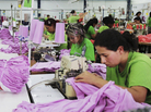Noreli Morales (right) works on the Planet Money women's T-shirt at a factory in Medellin, Colombia. Noreli Morales (right) works on the Planet Money women's T-shirt at a factory in Medellin, Colombia.