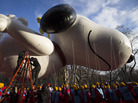 Workers prepare the giant Snoopy balloon before the 87th Annual Macy's Thanksgiving Day Parade on Thursday in New York. Workers prepare the giant Snoopy balloon before the 87th Annual Macy's Thanksgiving Day Parade on Thursday in New York.