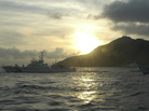 Japanese Coast Guard vessels sail alongside Japanese activists' fishing boat, not in photo, warning the activists away from a group of disputed islands called Diaoyu by China and Senkaku by Japan. Japanese Coast Guard vessels sail alongside Japanese activists' fishing boat, not in photo, warning the activists away from a group of disputed islands called Diaoyu by China and Senkaku by Japan.
