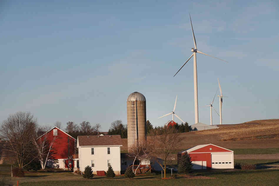 Wind turbines twirl above farmland on the outskirts of Madison, Wis. Not all locals are pleased. Wind turbines twirl above farmland on the outskirts of Madison, Wis. Not all locals are pleased.