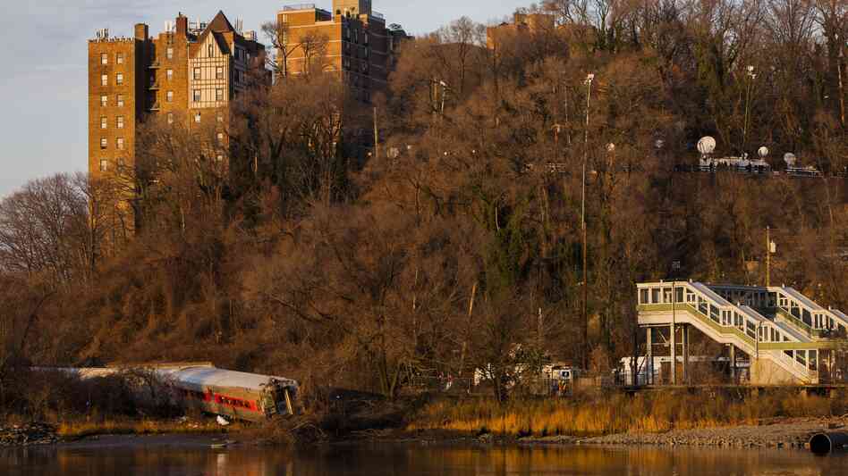 The wreckage of a Metro-North commuter train, which derailed Sunday just north of the Spuyten Duyvil station in Bronx, N.Y., lies on its side. The train was heading to Grand Central Terminal along the Hudson River. The wreckage of a Metro-North commuter train, which derailed Sunday just north of the Spuyten Duyvil station in Bronx, N.Y., lies on its side. The train was heading to Grand Central Terminal along the Hudson River.