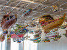The boats of For Those in Peril on the Sea, by artist Hew Locke, hang in the entrance hall of the Perez Art Museum Miami, which opens this week. The boats of For Those in Peril on the Sea, by artist Hew Locke, hang in the entrance hall of the Perez Art Museum Miami, which opens this week.